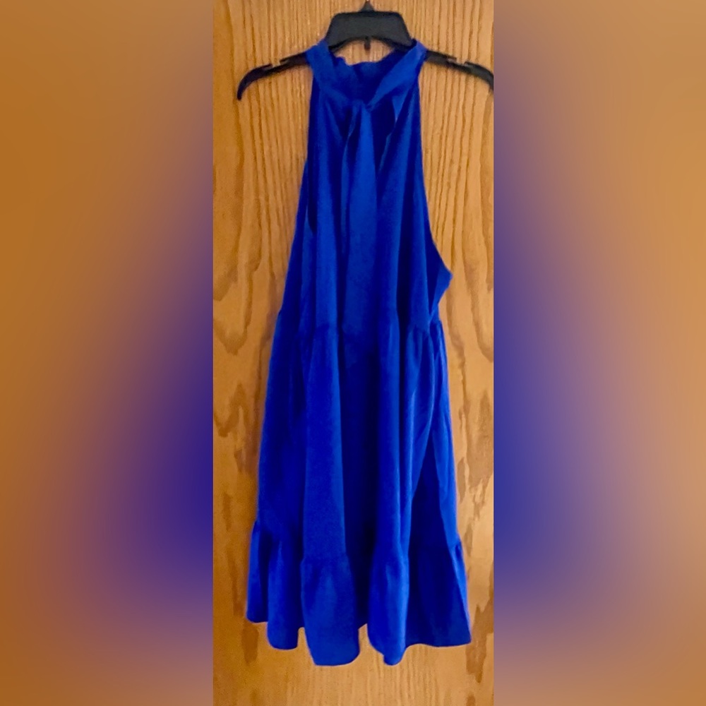 Beautiful halter dress with cascading ruffle accent.